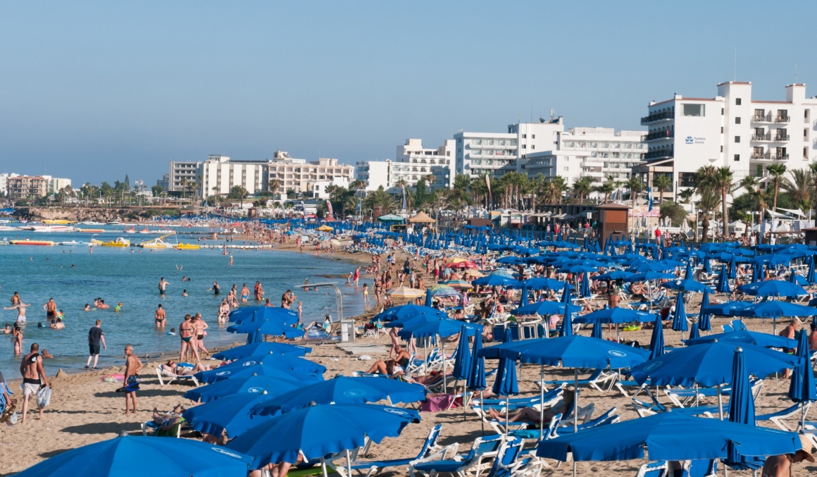 'PROTARAS,  CYPRUS -  July 8 2013: Tourists at Protaras bay beach relaxing and  enjoying their summer holidays on July 8 2013 at Protaras area in  Cyprus' - кипр